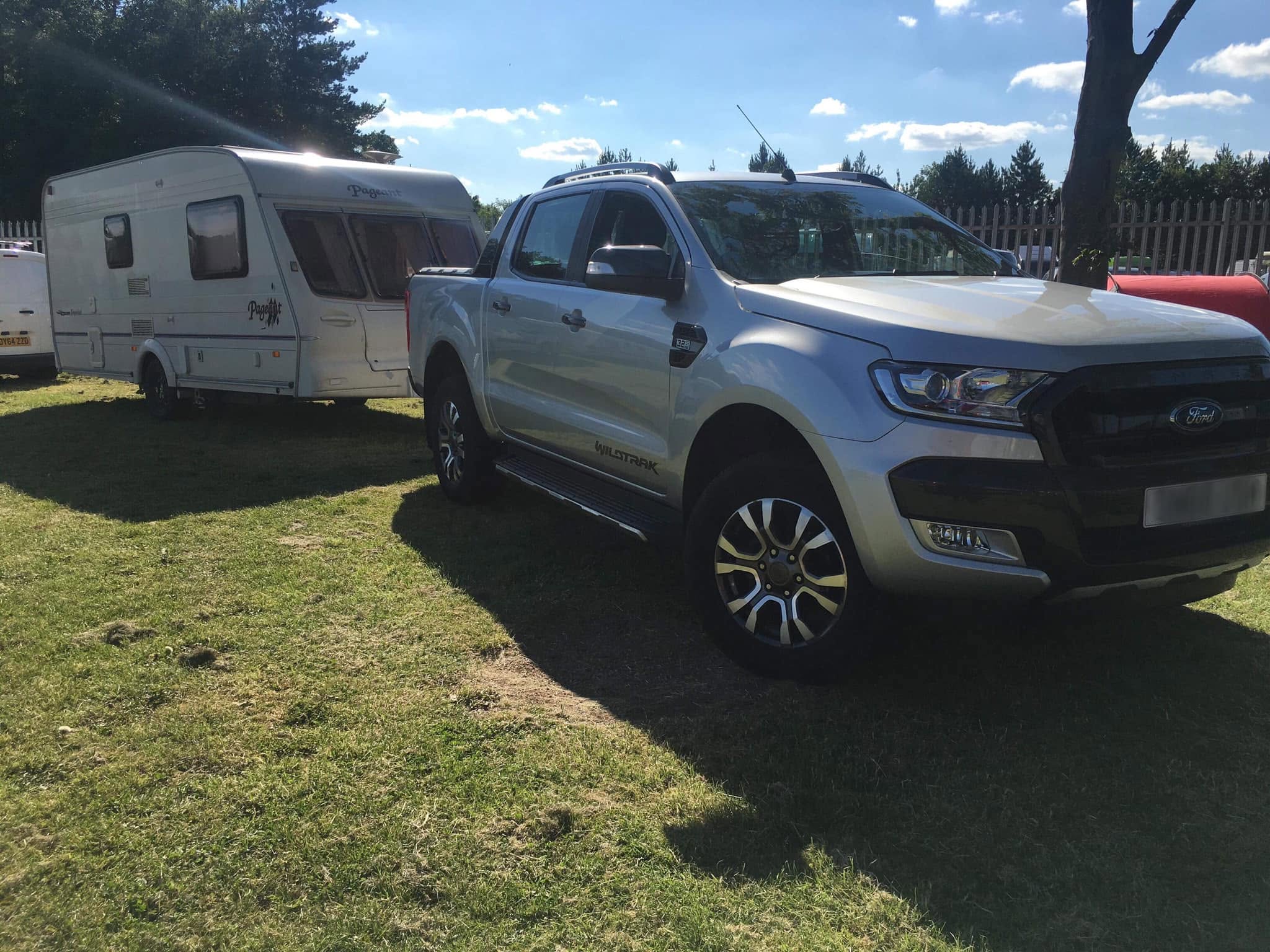 Caravan being towed as part of motorhome, caravan and campervan transport.